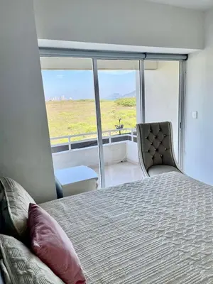 Cama o camas de una habitación en FRENTE AL MAR A PIE DE PLAYA ALBERCA y JACUZZI
