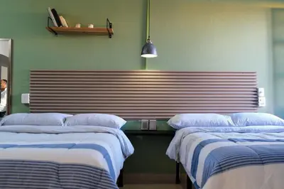 Cama o camas de una habitación en Remodeled Cozy Central 3 blocks from the Malecon