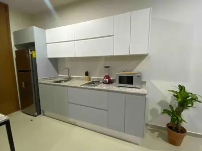 Una cocina o zona de cocina en Impecable loft, terraza, alberca, cerca de playa