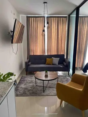 Zona de estar de Impecable loft, terraza, alberca, cerca de playa