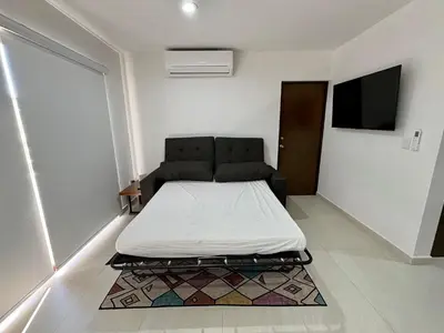 Una televisión o centro de entretenimiento en Fantástico departamento en Cerritos OCEANNA Frente al MAR - 237 A -