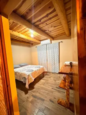 Cama o camas de una habitación en Cabañas Villa Escondida