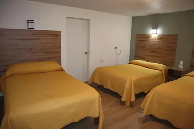 Cama o camas de una habitación en La Casona de los Abuelos
