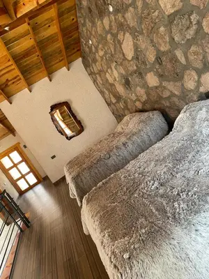Cama o camas de una habitación en Cabañas El Potrero