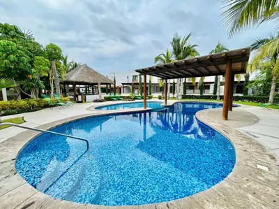 Piscina en o cerca de Casa en privada cerca de la playa y la Marina