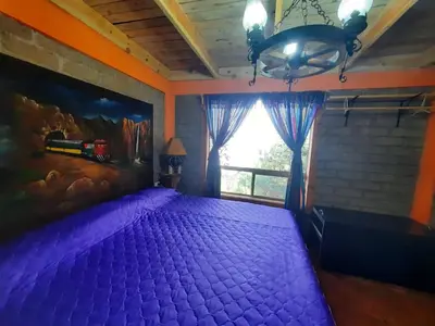 Cama o camas de una habitación en Cabañas Los Cascabeles