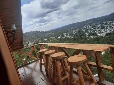 Un balcón o terraza de Cabañas Los Cascabeles