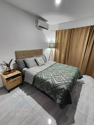 Cama o camas de una habitación en Cómodo departamento vacacional con amenidades