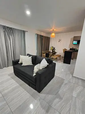 Zona de estar de Cómodo departamento vacacional con amenidades