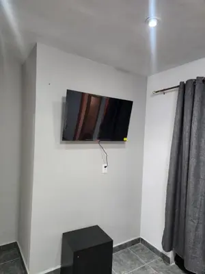 Una televisión o centro de entretenimiento en Departamentos