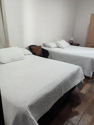 Cama o camas de una habitación en Condominio Mar y Arena