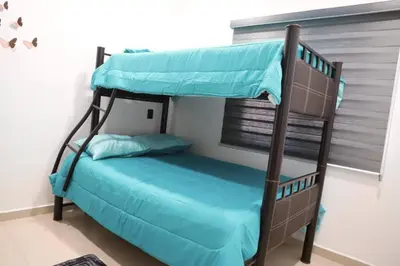 Cama o camas de una habitación en Dpto de 2 recamaras con alberca