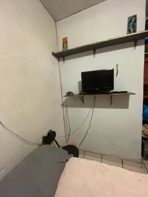 Una televisión o centro de entretenimiento en Cativa CozyHomestay