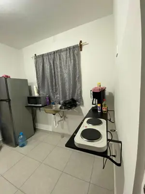 Una cocina o zona de cocina en Departamento privado con piscina