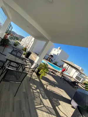 Un balcón o terraza de Departamento privado con piscina
