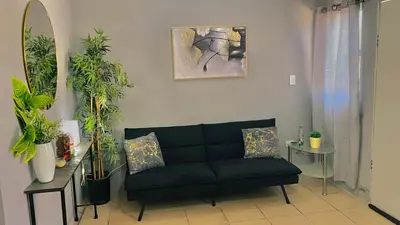 Zona de estar de Casa Huésped a 5 minutos del Aeropuerto
