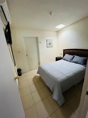 Cama o camas de una habitación en Casa Huésped a 5 minutos del Aeropuerto