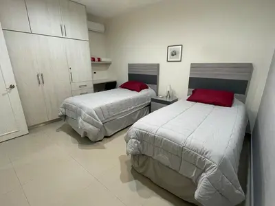 Cama o camas de una habitación en Apartamento en PB con piscina a poca distancia de la playa