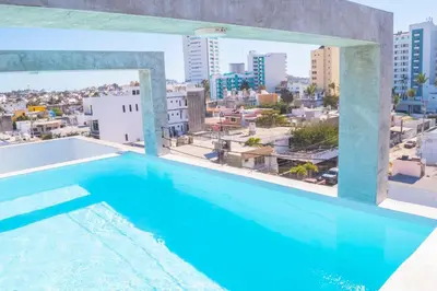 Piscina en o cerca de Loft a 3 cuadras de la playa by G P S rentas