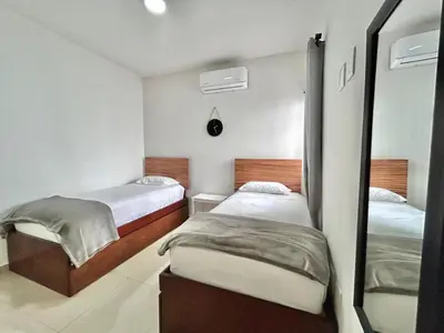 Cama o camas de una habitación en Depa near zona dorada and malecón by G P S rentas