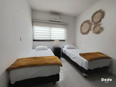Cama o camas de una habitación en Departamentos en el centro de Mazatlán