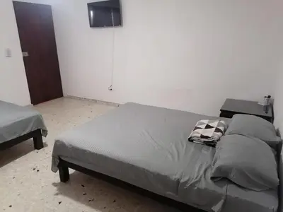 Cama o camas de una habitación en Torre Romo Departamento 1-1
