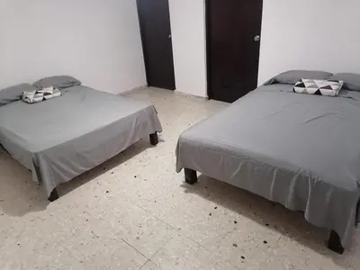 Cama o camas de una habitación en Torre Romo Departamento 1-1