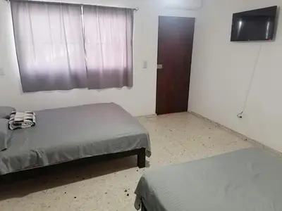 Cama o camas de una habitación en Torre Romo Departamento 1-1
