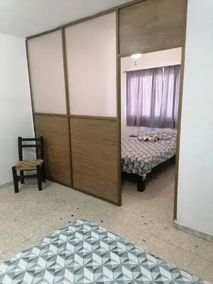 Cama o camas de una habitación en Torre Romo Departamento 1-2