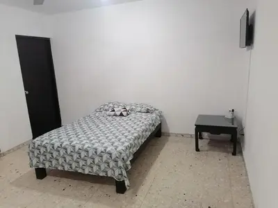Cama o camas de una habitación en Torre Romo Departamento 1-2