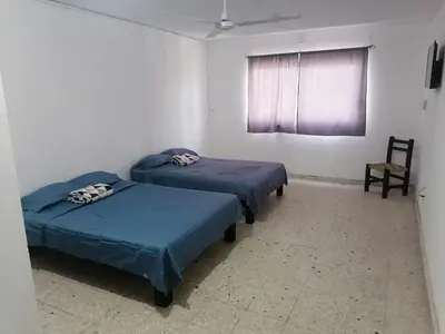Cama o camas de una habitación en Torre Romo Departamento 1-3
