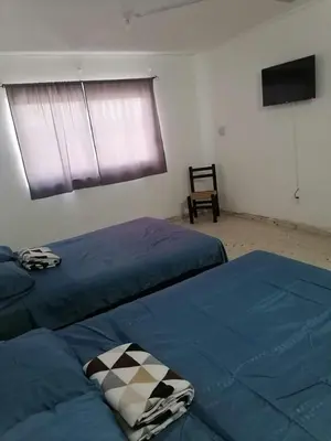 Cama o camas de una habitación en Torre Romo Departamento 1-3