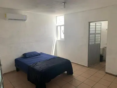 Cama o camas de una habitación en Torre Romo Departamento 5