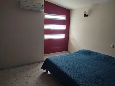 Cama o camas de una habitación en Casa Grande Céntrico cerca del Malecón