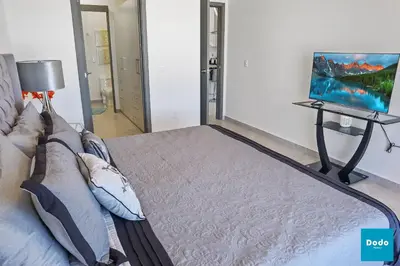 Cama o camas de una habitación en Torre con roof garden y piscina vista al mar