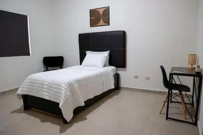 Cama o camas de una habitación en Casa Bonita y Amplia