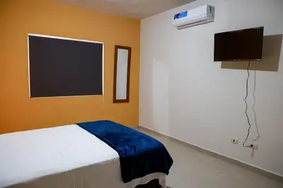 Una televisión o centro de entretenimiento en Casa Bonita y Amplia