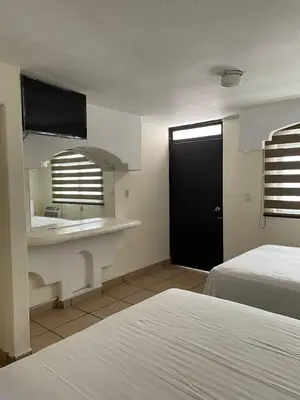 Cama o camas de una habitación en Hotel Vistamar