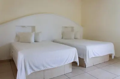 Cama o camas de una habitación en Hotel Vistamar