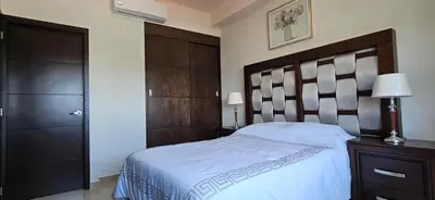 Cama o camas de una habitación en Departamento Torre Iberika Cercas Del Malecon