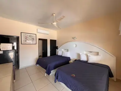 Cama o camas de una habitación en Hotel Oasis