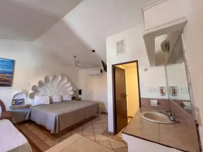 Cama o camas de una habitación en Hotel Oasis