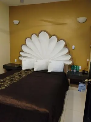 Cama o camas de una habitación en Hotel Oasis