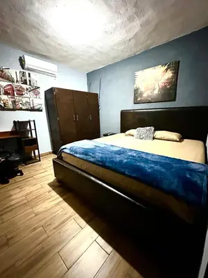 Cama o camas de una habitación en Departamento Mateos 504