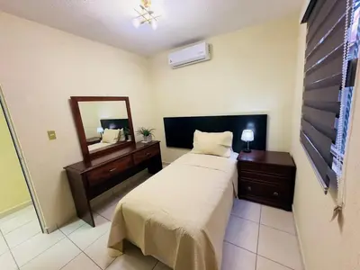 Cama o camas de una habitación en Casa California de una planta