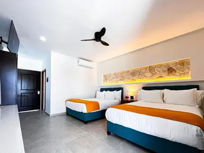 Cama o camas de una habitación en Hotel Loreto Palmar
