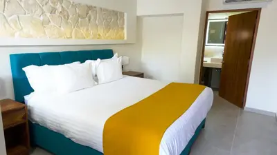 Cama o camas de una habitación en Hotel Loreto Palmar