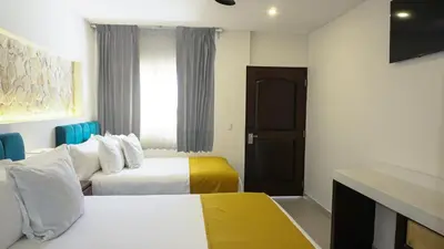 Cama o camas de una habitación en Hotel Loreto Palmar