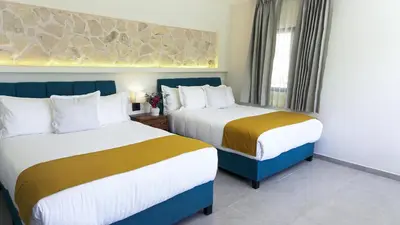 Cama o camas de una habitación en Hotel Loreto Palmar