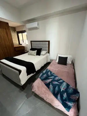 Cama o camas de una habitación en Malecon de Mazatlán 9